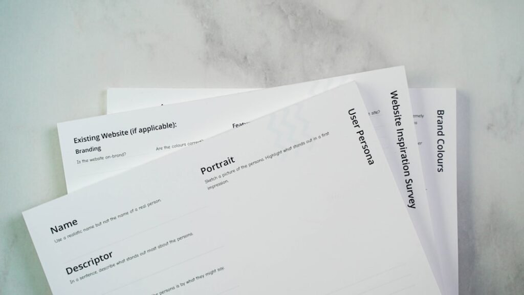 a close up of three papers on a table