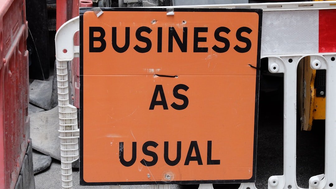 A sign that says business as usual on it
